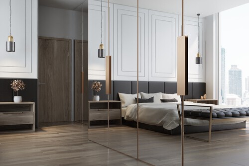 stylish bedroom with wardrobe mirrors